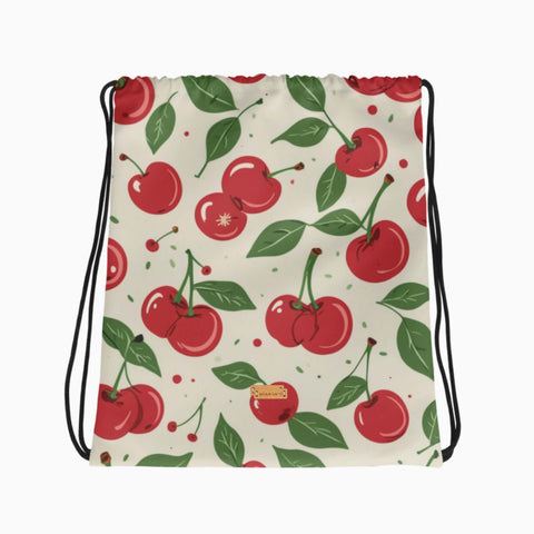 Turnbeutel mit Kirschenmuster auf cremefarbenem Hintergrund, flach ausgelegt.